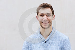Front portrait of handsome young man smiling and looking at camera