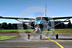 Front of propeller airplane shot with blue sky