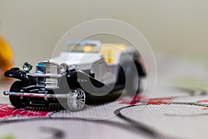 Front quarter shot of a vintage toy car with open top in close up