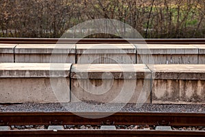 Selective blur on a train station platform made of concrete, modern