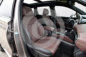 Front seats upholstered in red leather in a large modern SUV