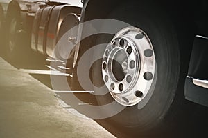 Front of Semi Truck Wheels Tires. Chrome Wheels. Rubber, Vechicle Tyres. Freight Trucks Cargo Transport photo