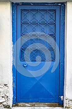 Front shoot of blue colored metal door with traditional turkish pattern