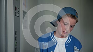 Front shot of kid waiting for elevator