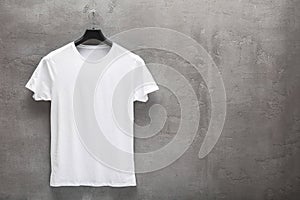 Front side of male white cotton t-shirt on a hanger