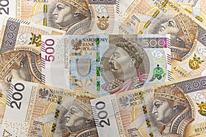 The front side of a rare Polish 500 PLN banknote lying between 200 PLN,  Polish zloty banknotes.