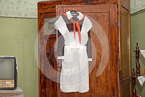 The front Soviet school uniform with a pioneering tie hanging on