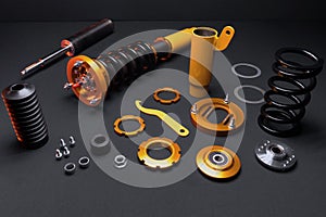 front springs in yellow and gold colors for a sports drift car on a dark background