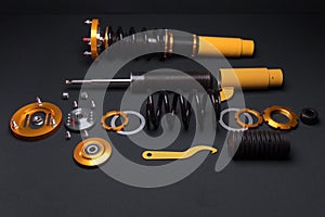 front springs in yellow and gold colors for a sports drift car on a dark background