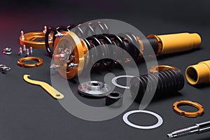 front springs in yellow and gold colors for a sports drift car on a dark background