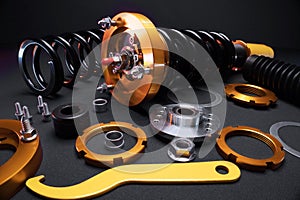 front springs in yellow and gold colors for a sports drift car on a dark background