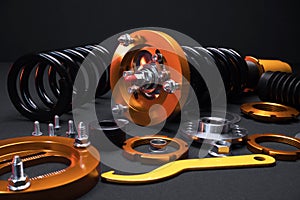 front springs in yellow and gold colors for a sports drift car on a dark background