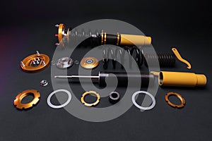 front springs in yellow and gold colors for a sports drift car on a dark background