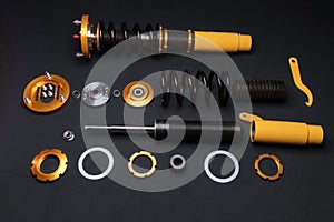 front springs in yellow and gold colors for a sports drift car on a dark background