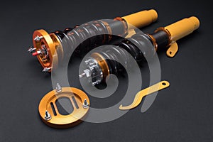 front springs in yellow and gold colors for a sports drift car on a dark background