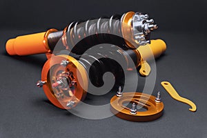 front springs in yellow and gold colors for a sports drift car on a dark background