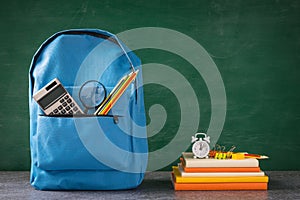 Front of stylish school bag backpack and stationery