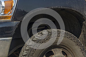 Front of the SUV, wheel, suspension, car wing closeup