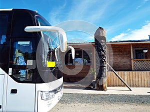 The front of the tourist bus against the backdrop of blue skies and local exoticism