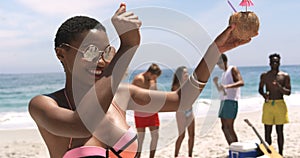 Front view of African American woman dancing on the beach 4k