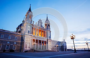 Almudena Cathedral illuminated during dusk at Armeria square photo