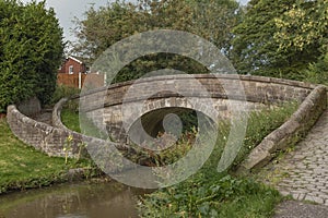 Front view of an ancient canal tow path bridge