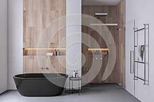 Front view of bathroom interior design with tiles grey floor and wooden walls with black bath. 3D Rendering