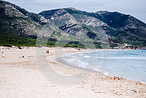 Front view of beach with mountains in the background