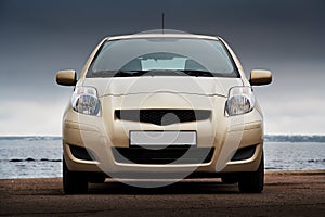 Front view of a beige car