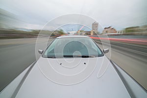 Front view of black car with heavy blurred motion.