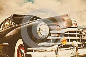 Front view of a black fifties American car