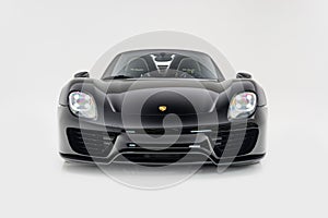 Front view of a black Porsche 918 Spyder on a white background