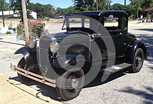 Front View of black 1940's Ford antique car.