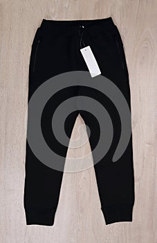 Front view black sweatpants with label