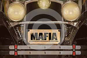 Vintage American car with Mafia license plate photo