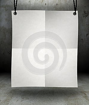 Front view of blank paper poster hanging on rope