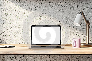 Front view on blank white modern laptop monitor with space for web design, website or landing page on wooden work table with pink