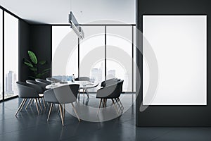 Front view on blank white poster on black wall in stylish sunlit meeting room with modern dark furniture and city view through