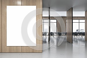 Front view on blank white poster with space for your logo or advertising text on wooden wall partition in stylish conference area