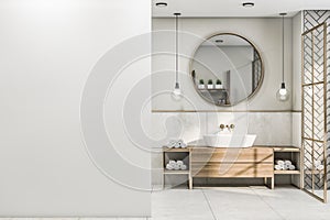 Front view on blank white wall in stylish bathroom with round wooden frame mirror, modern light bulbs from top, wooden sink