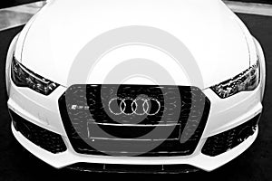 Front view of a blue modern luxury blue sport car Audi RS 6 Avant Quattro 2017. Car exterior details. Black and white.