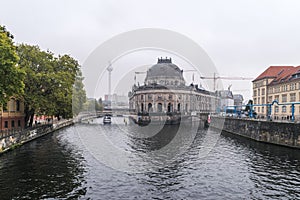 A front view of Bode museum and the river Spree in autumnal Berlin