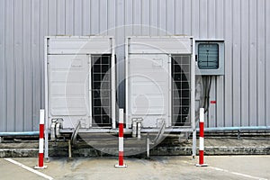 A front view of both big air with a traffic cone warning condition beside a corrugated metal fence