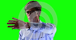 Front view of a Caucasian man touching the screen with green screen