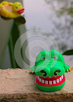 Front view of children`s toys near the fish pond photo