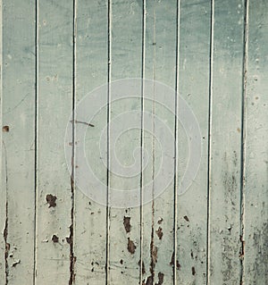 Front view and close-up shot of vintage wooden door with peeling paint shows beautiful texture of grunge and antique texture