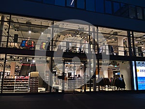Closed Zalando outlet store, mainly selling shoes and clothing, in downtown with illuminated shop windows during lockdown.