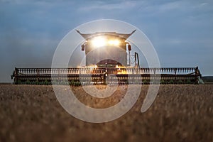 Front view of a combine harvester in the evening photo