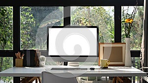 Computer pc with empty display on white table in home office.