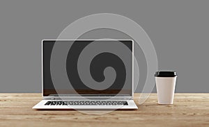 Front view of cup and laptop on wooden table in office. Isolated. 3D illustration.